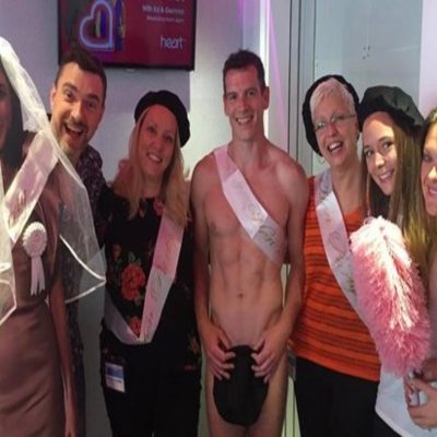 Naked male stripper and customers from hen party at life drawing class in Ireland